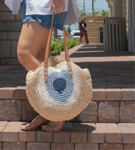 Woven evil eye handbag
